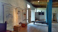 A room with a wooden floor and wooden walls.