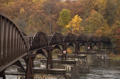 A bridge crosses the Potomac River along the Great Allegheny Passage