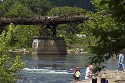 People walk along the Youghiogheny River above Ohiopyle Falls
