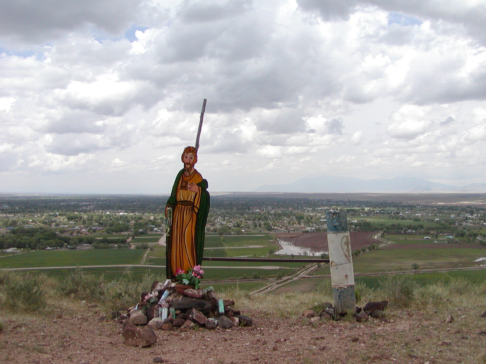 A statue on top of a hill.