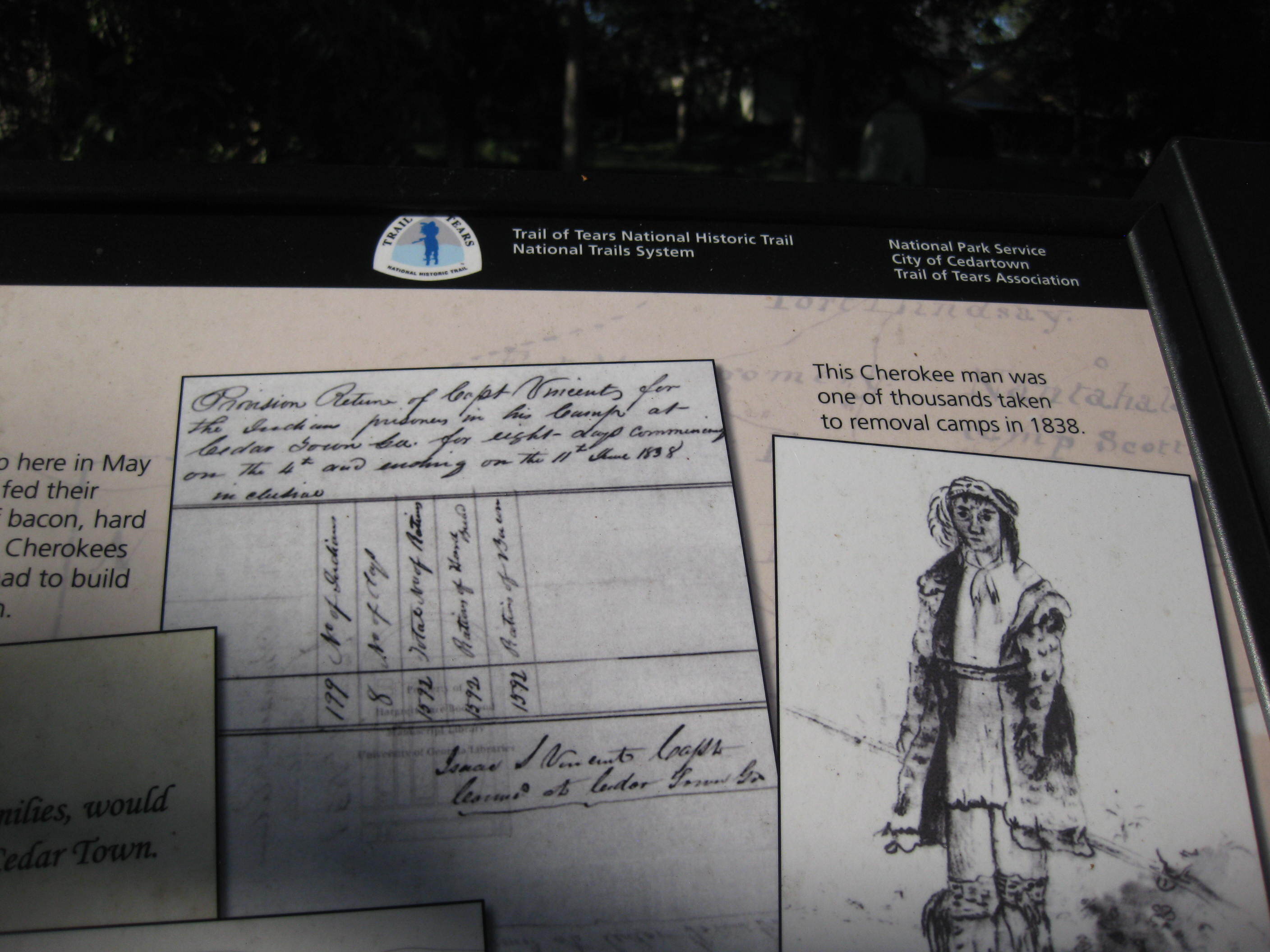 An informational display with historical photographs and text.