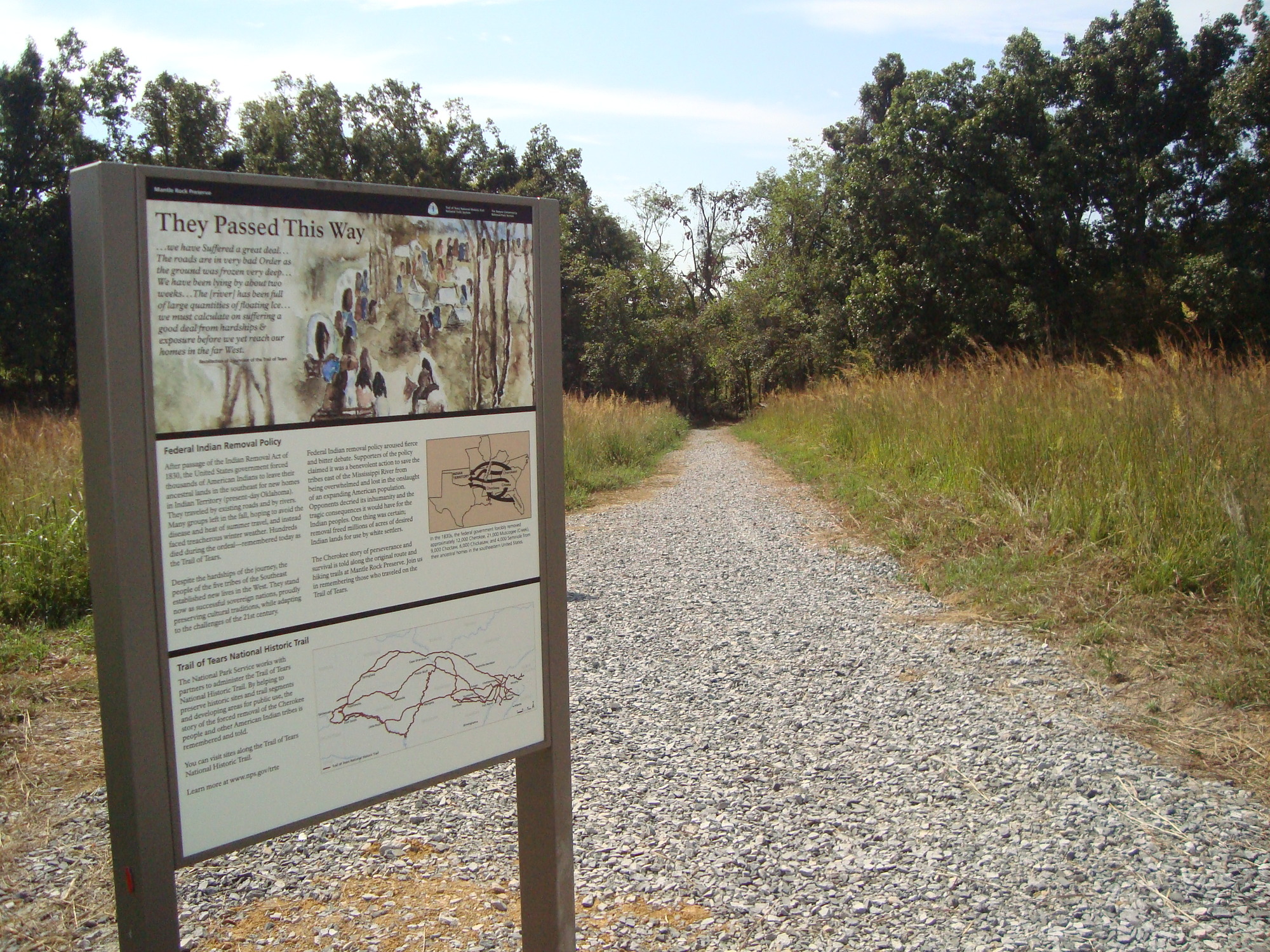 A wayside on a gravel path.