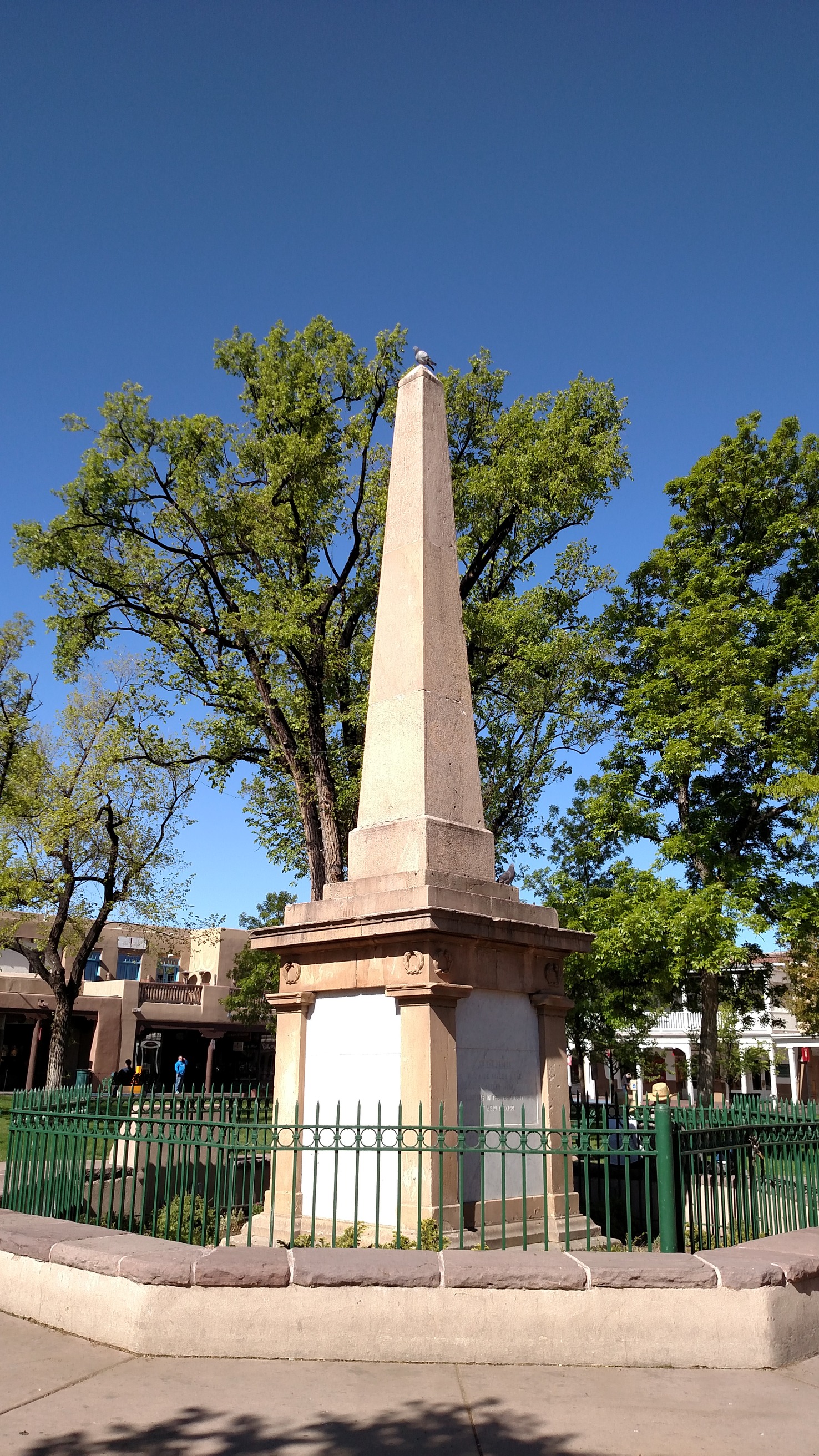 A Monument is a with trees in the background.