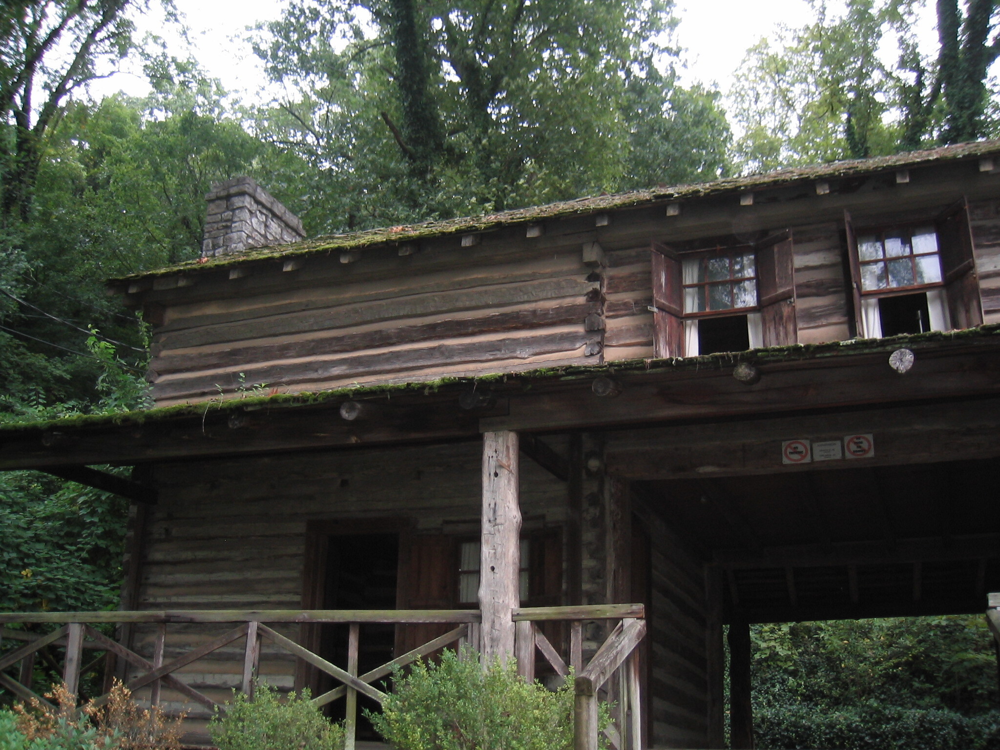 A log cabin in the woods.