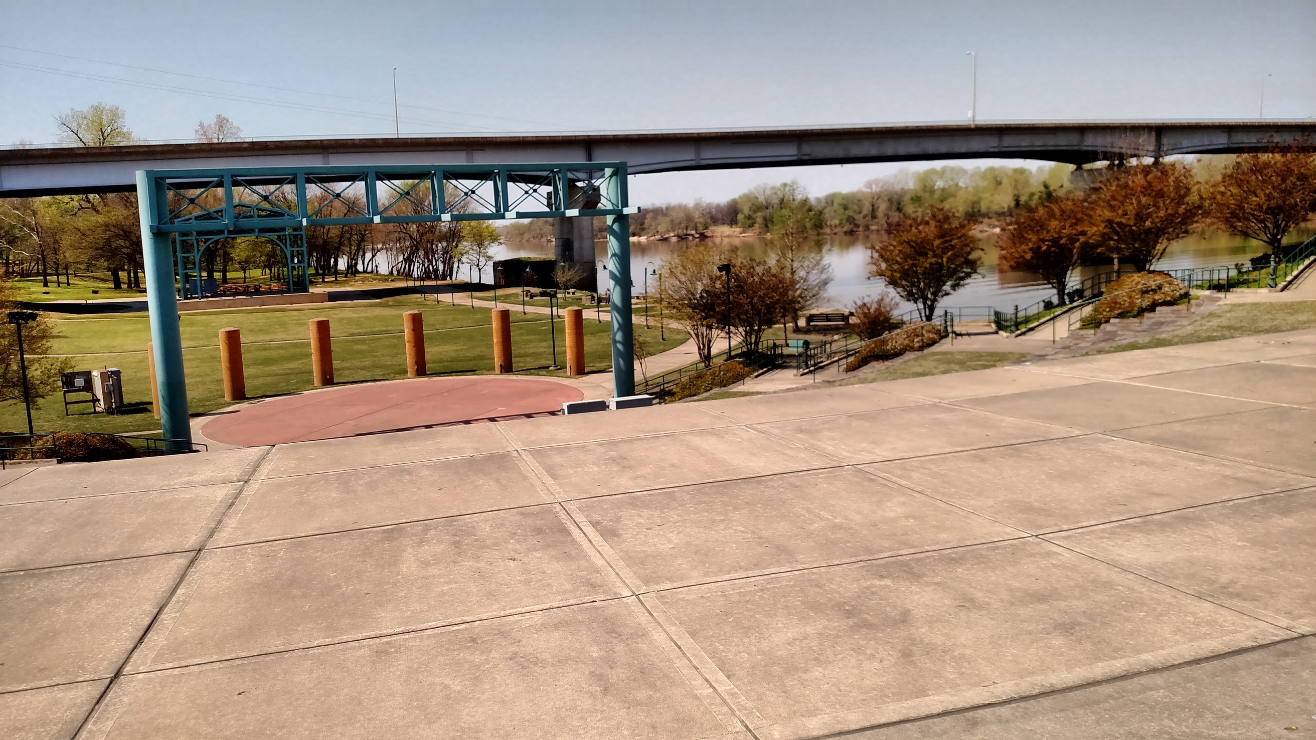 A park with a bridge over it.