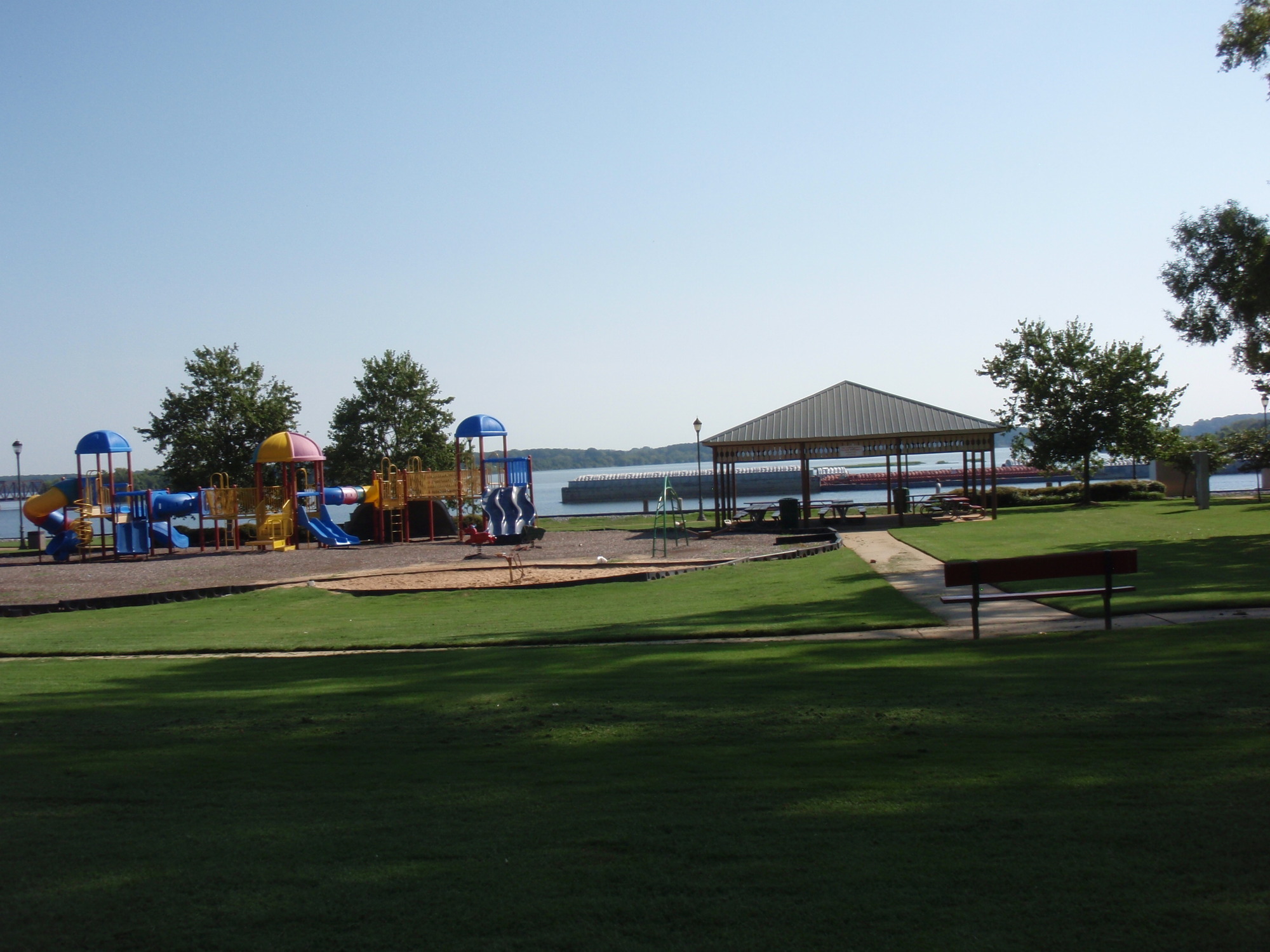 A grassy area with a playground.