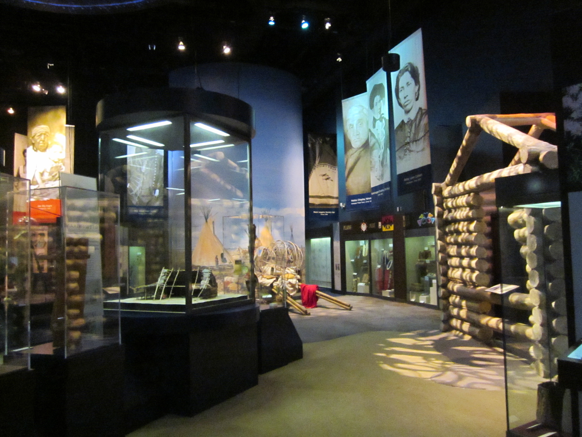 A museum setting with a lot of items on display.