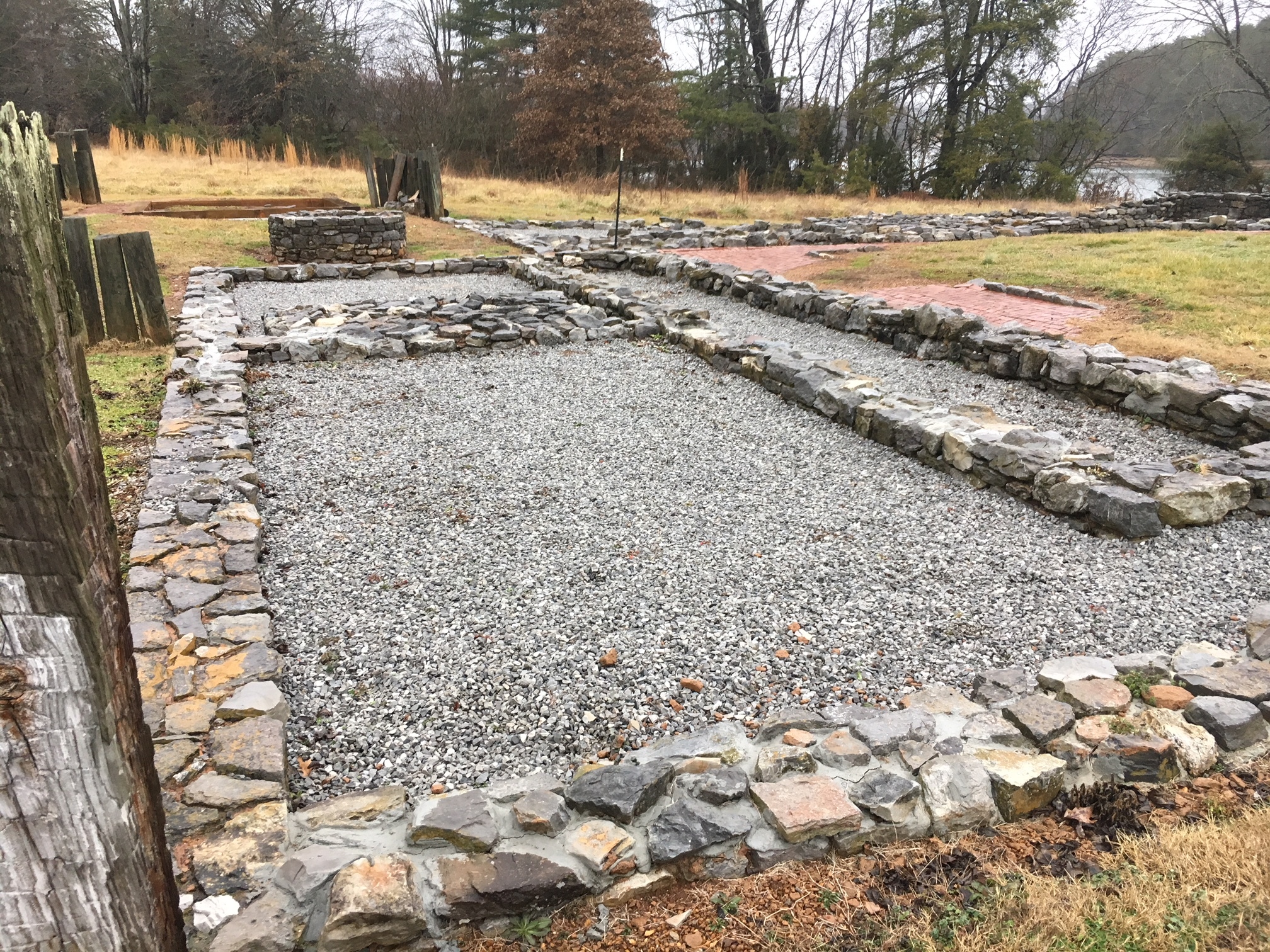 A boundary of stone in the middle of a field.