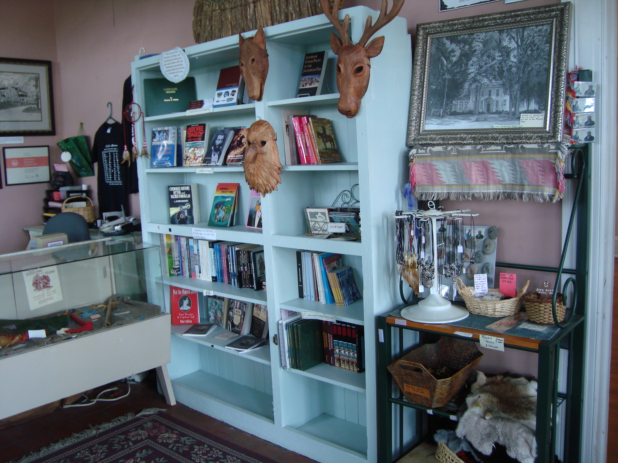 A bookcase with some items on it.