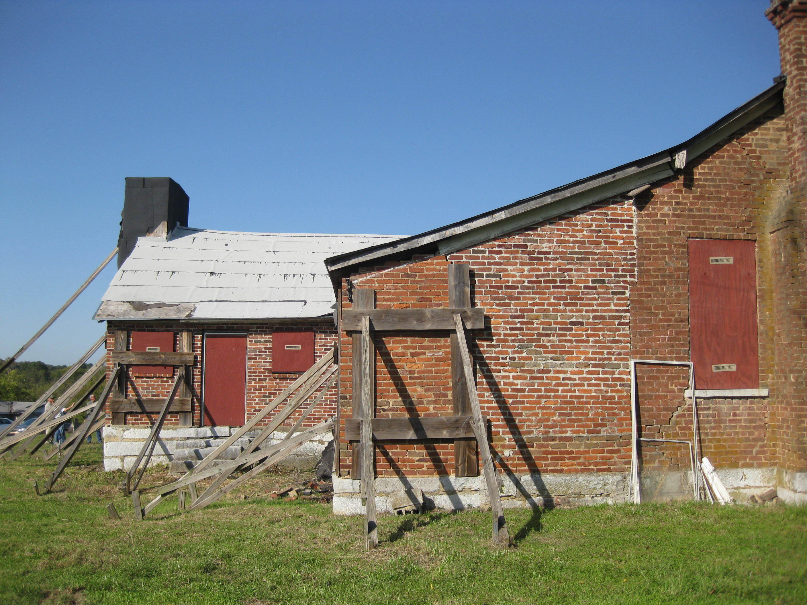 A brick building with a blue sky in the background.