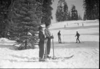 Two good skiers. 'Sis' Lenore Oehlmann and Mrs. Goldsworthy (Gabrielle Souvlewski). Also written on the envelope which was probably used as a press release - "Ready to start out on a climb of one of the longest ski runs along the new Glacier Point Road. The return trip will be full of thrills." Location - Badger Pass.