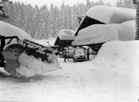 Heavy snow at Badger Pass and snowplows.
