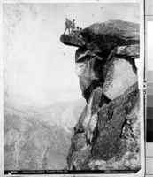 Copy Neg: 1985 by Michael Dixon. Overhanging Rock, Glacier Point. Hutchings and another man standing, two ladies and a man seated on overhanging rock.