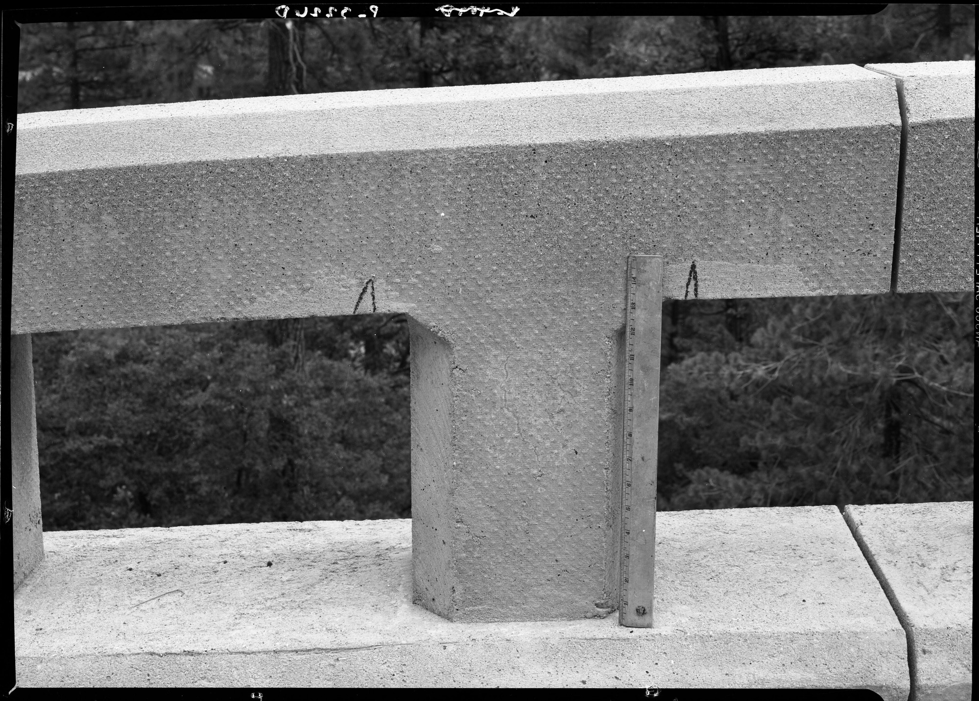 Concrete on bridge over Wildcat Creek on Big Oak Flat Road, showing checking in progress.