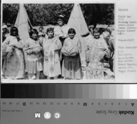 Showing handcraft. Alice James center, Maggie Howard right. [L-R: Tina Charlie, Carrie Bethel, Alice Wilson, Forest Townsley, Leanna Tom, Maggie Howard].