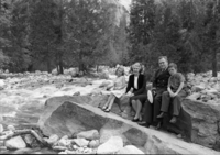 John Q. Martin (Chaplain) and family sitting on rock near Lower Yosemite Fall.