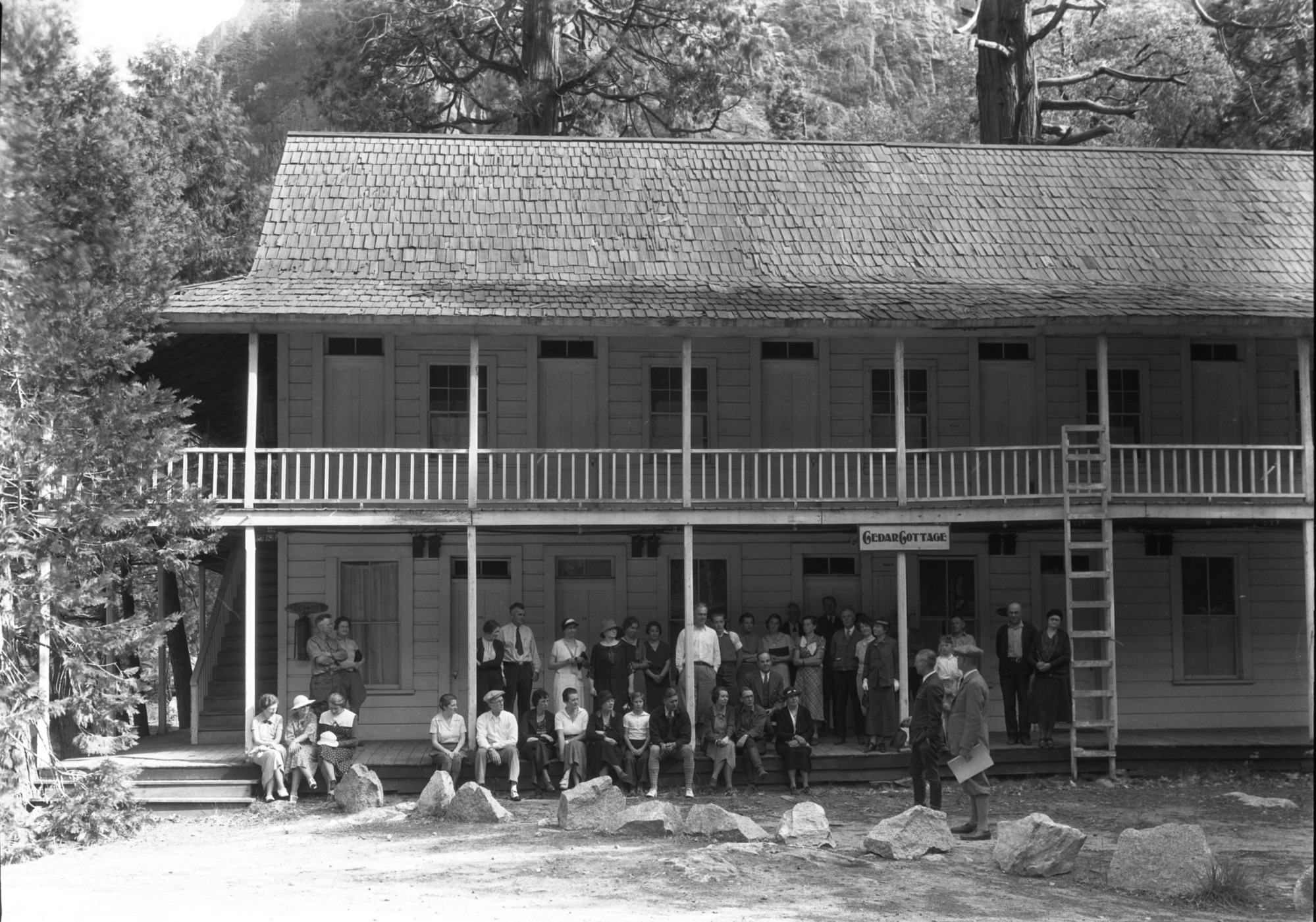 Visitors to the Muir celebration in front of Cedar Cottage. Bert Harwell in NPS uniform, standing on left.