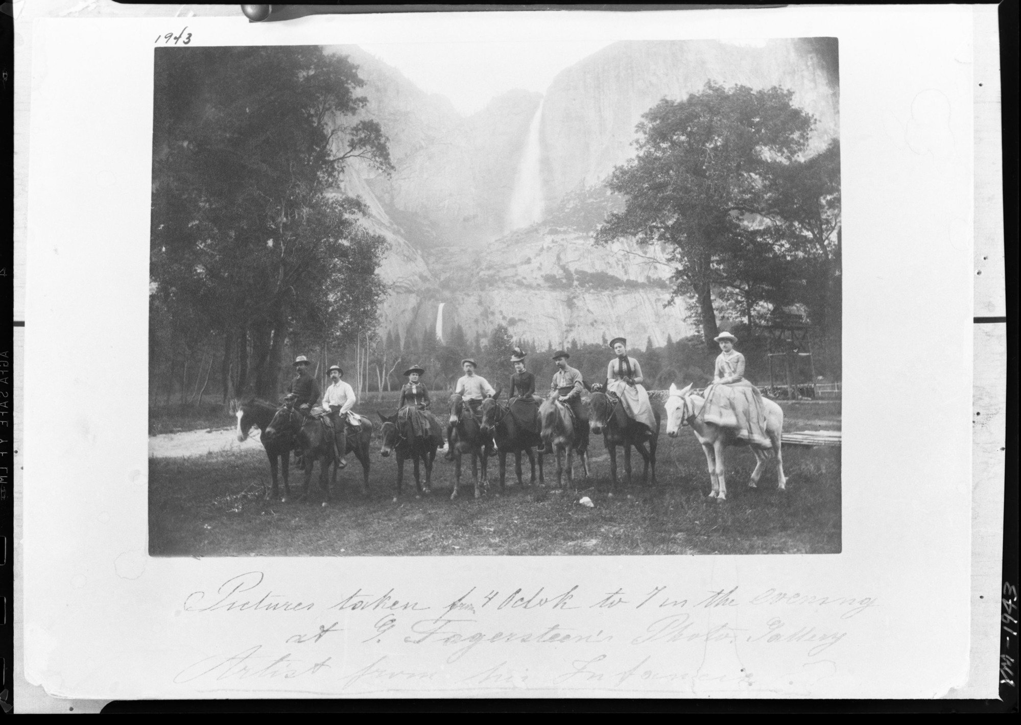 Large saddle party of tourists. Yosemite Falls in background.