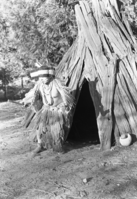 Chris Brown, "Chief Lemee," and regalia in back of the Museum.