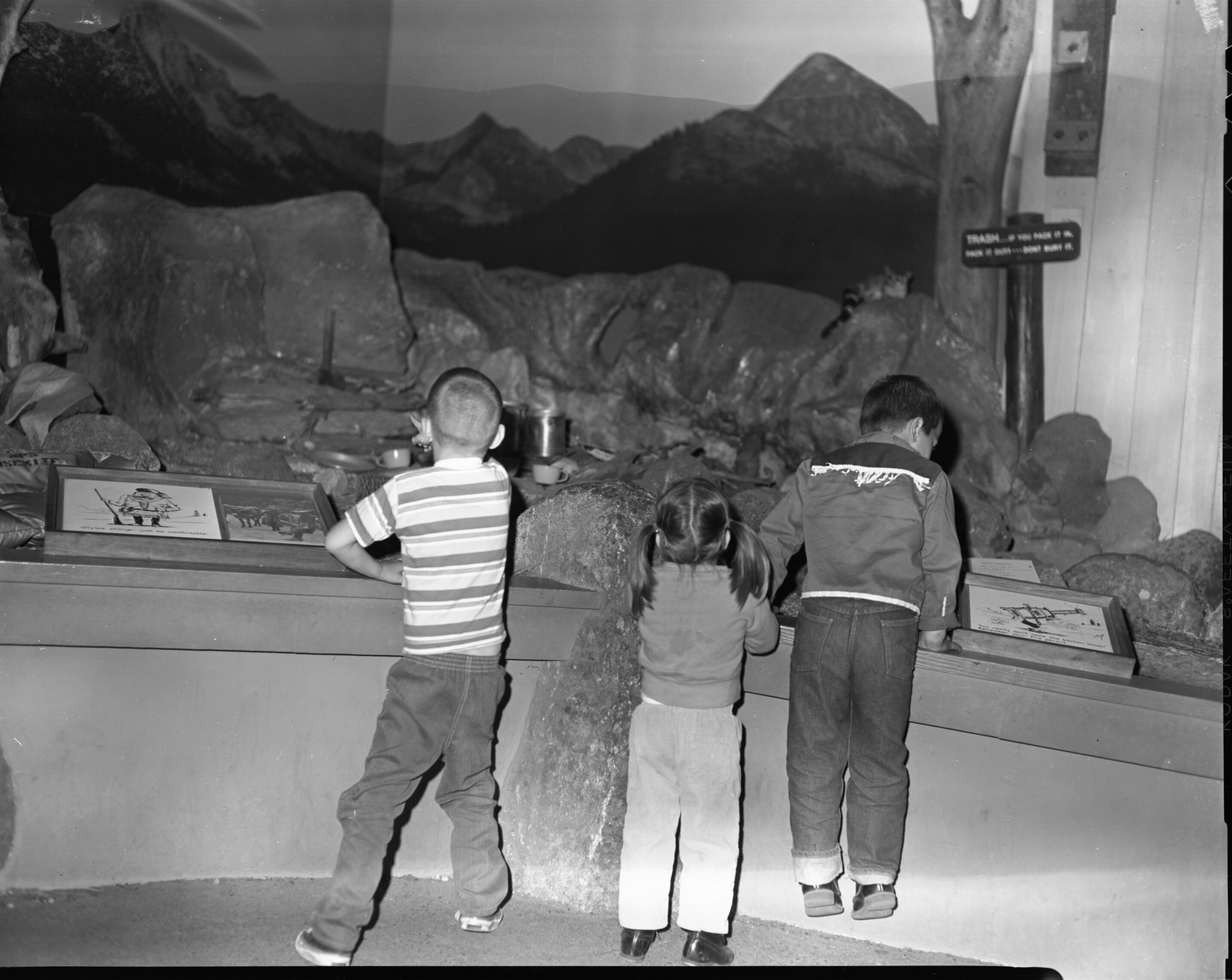 Camping Exhibit. Three Children Viewing Exhibit.