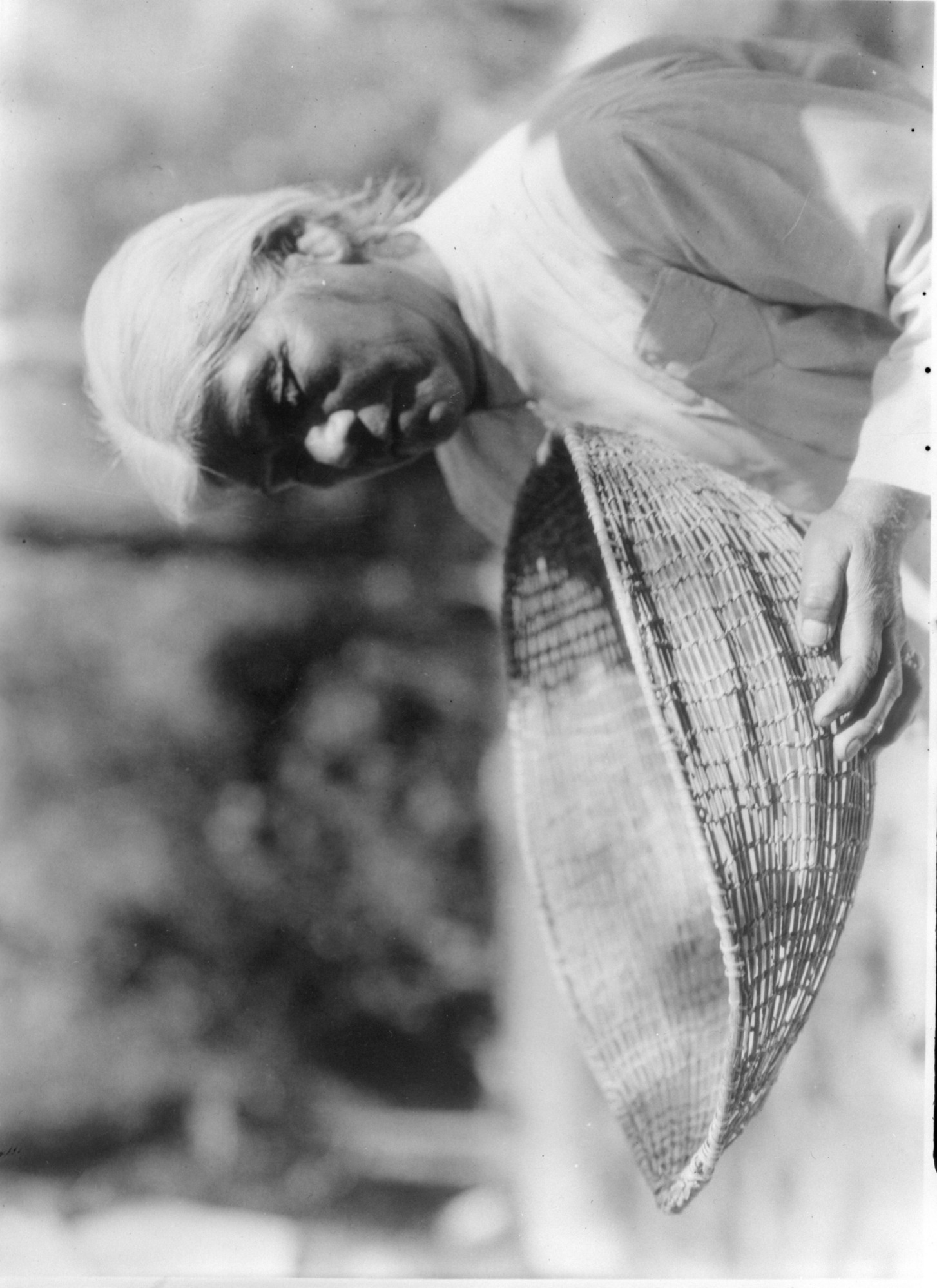 Southern Miwok woman with sifting basket