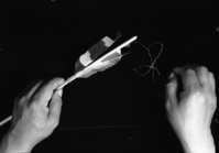 Le-me feathering an arrow.