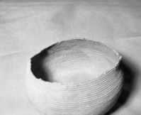 Mrs. Geraldine McConnell Collection. Object: Basket found in a cave at Knights Ferry, on the Stanislaus River. Excavated in the late 1960s. Dimensions: 10" x 5". Materials: Bulrush root pattern, sedge root, and scraped shoots. Technology: Split stitching, fag ends concealed in foundation, moving ends bound under. Notes: Basket is quite soiled and appears to have been buried in an ash deposit. Resembles a Patwin basket in design, technology and materials. Perhaps it was obtained in trade by native residents of Knights Ferry. Photographed by Michael Dixon in January 1983. Catalogued by Craig Bates and Barbara Beroza. Yosemite Collections, National Park Service.