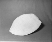 Mrs. Donald Segerstrom Collection. Object: Northern Paiute or Washoe sifter. Dimensions: 19 1/2 x 16 1/2". Materials: Entirely willow. Technology: Diagonally twined, warp rods twined over one another. Collection History: Attached tag reads "Mi-wuk one rod." Photographed by Michael Dixon. Catalogued by Craig Bates and Barbara Beroza. Yosemite Collections, National Park Service. 1/83.