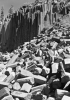 Hikers resting on talus slope of Devil Postpile.