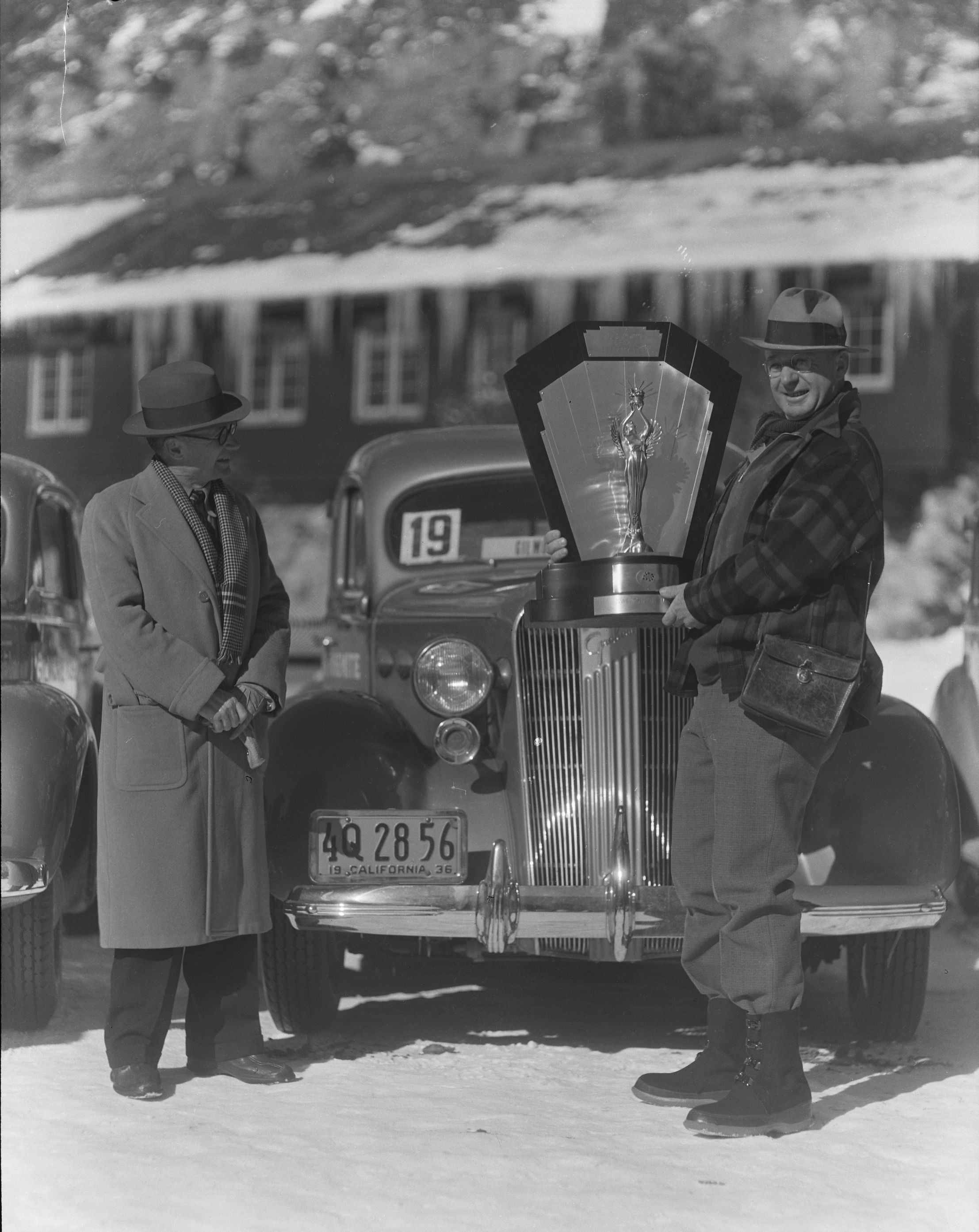 Gilmore Economy Run. Mr. Gilmore presenting the Sweepstakes trophy to driver of Graham Supercharger.