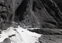 Cliff walls around ice cone at foot Yosemite Fall.