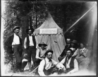 Sign on tent say "PURISSIMA". (8 people in front of tent); copied by Michael Dixon, copied November 3, 1986