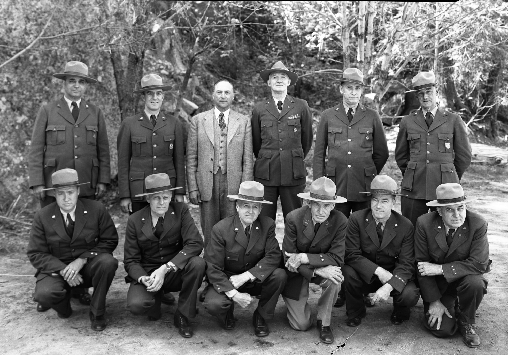 Superintendents at Yosemite Fire Conference for Region Four. L-R: back row- Preston Macy, Olympic; Jim Cole, Joshua Tree; Major Tomlinson, Regional Director; Colonel White, Sequoia; Ernest Leavitt, Crater Lake; Don Fisher, Lava Beds; Front- Harry Buckley, Silver Creek Rec. Area; John Preston, Mt. Ranier; Frank A. Kittredge, Yosemite; Ray Goodwin, Death Valley; Jimmy Lloyd, Lassen; Walter Finn, Muir Woods