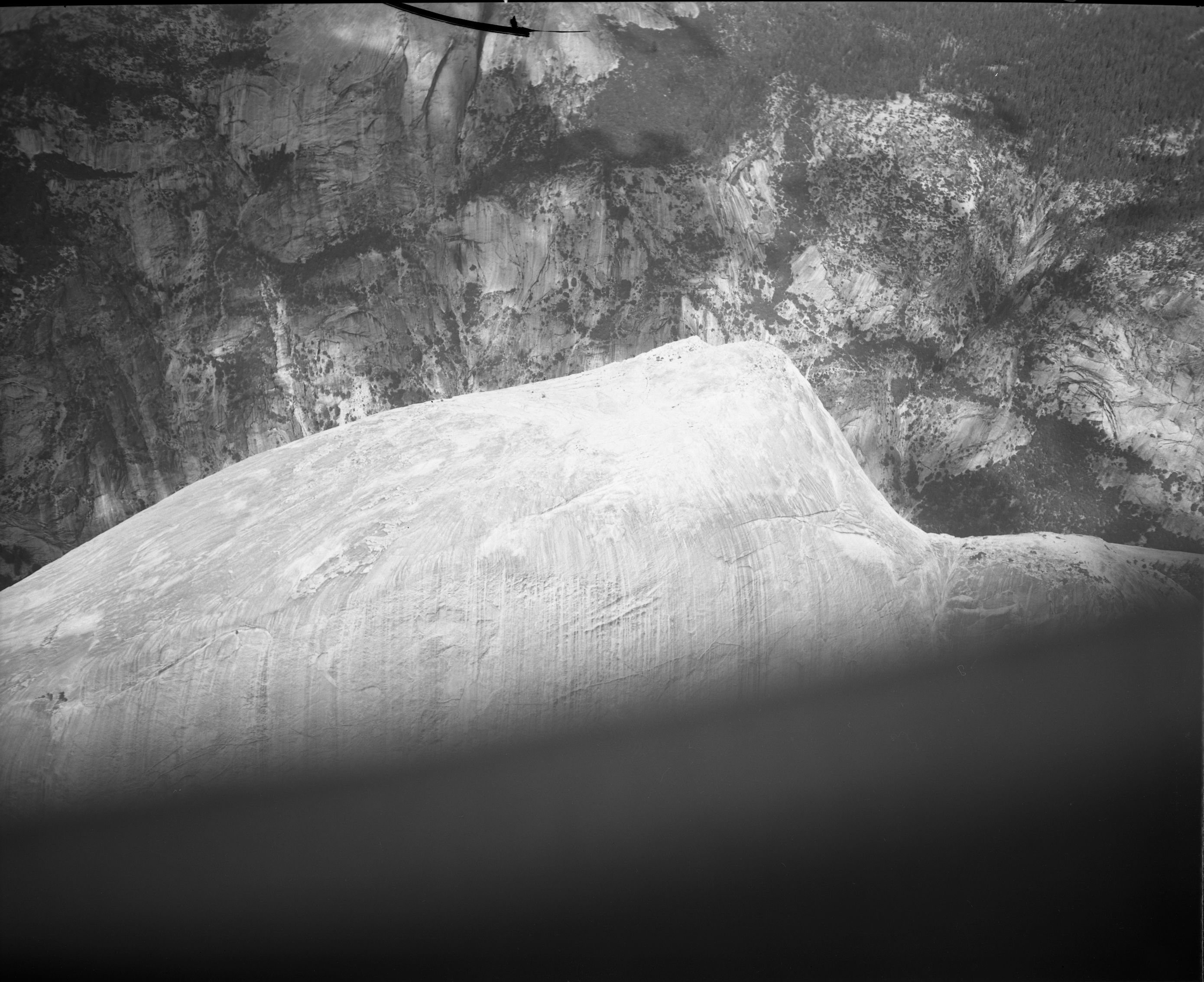 Aerial photograph of flight over park showing Half Dome and aerial of Yosemite National Park.