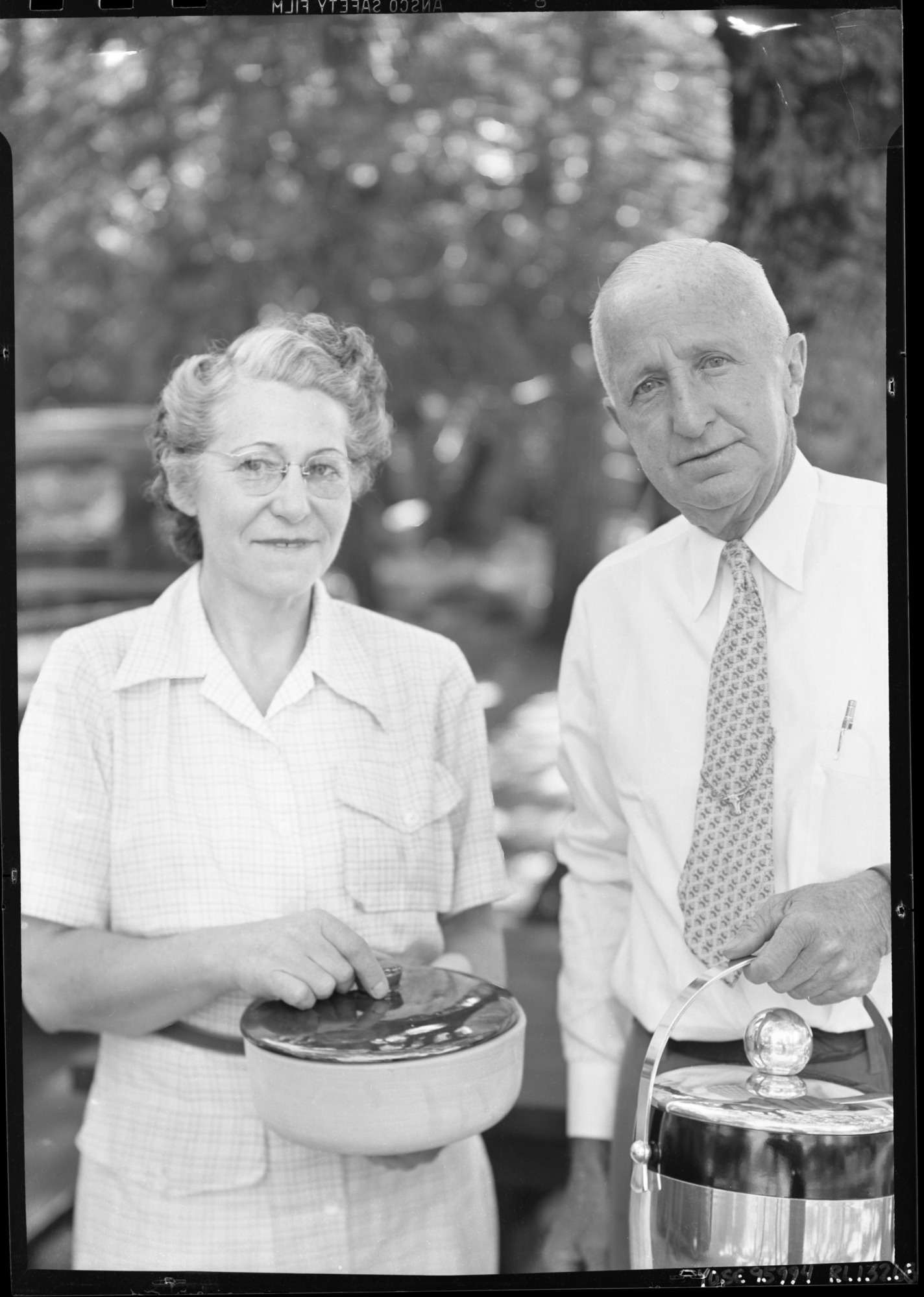 Frank Bayley Ewing and Grace Sovulewski Ewing upon retirement from NPS. Ewing, Frank Bayley. Born Rattlesnake Bar, Eldorado County, Calif. June 8, 1885. Grandfather on mother's side was partner of Marshall who discovered gold at Sutters Hill. Married Grace Charlotte Sovuleski. Employed with U.S. Geodetic Survey; came to Yosemite as Ranger April 16, 1916; became Asst. General Foreman January 1, 1919 and Asst. Park Supervisor in charge of Roads and Trails May 1, 1920. Retired from National Park Service June 30, 1950. Frank Ewing organized pack trip for Stephen T. Mather and a large group of his friends who went over the John Muir Trail during the summer of 1915.