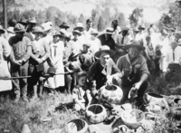 Field Days Yosemite Valley. Supt. Lewis and Chief Ranger Forrest Townsley poised with baskets woven by Lucy Telles. [Little boy is Carl Lewis, son of Supt. W.B. Lewis.]