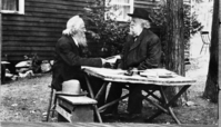 Copy photo of Galen Clark and George Fiske at cabin. Photographer: George Fiske?