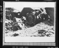 Copy Neg: J. Ernest, 1983. Engine No. 28 piled up in Merced Canyon following Al Yoakum wreck. (Printed in Hank Johnston's Railroads of Yosemite Valley.) Original print in the over-sized photo drawer in RL.