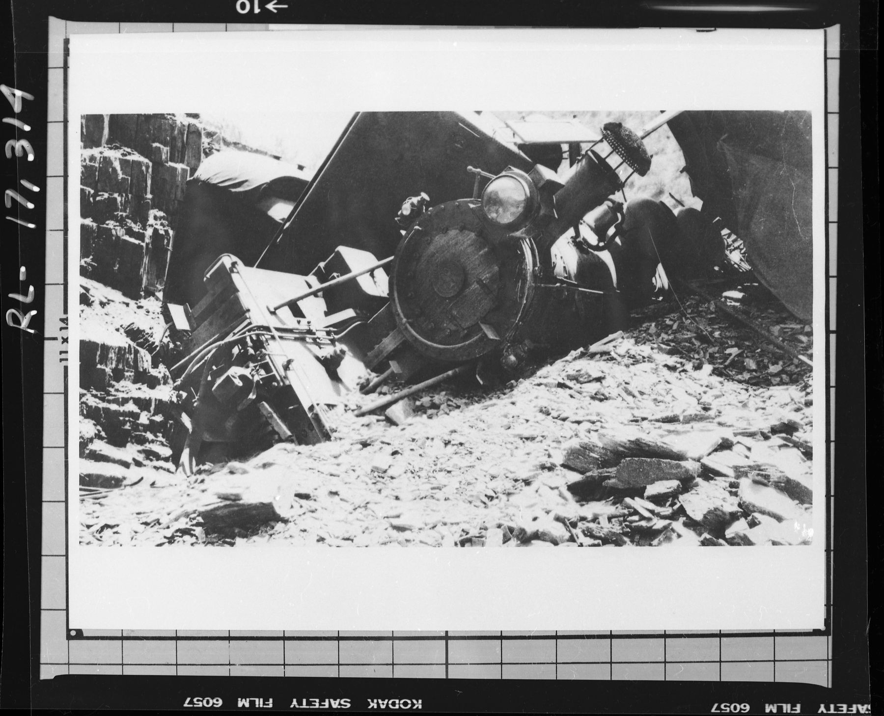 Copy Neg: J. Ernest, 1983. Engine No. 28 piled up in Merced Canyon following Al Yoakum wreck. (Printed in Hank Johnston's Railroads of Yosemite Valley.) Original print in the over-sized photo drawer in RL.