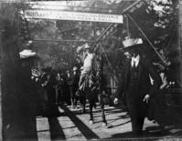 Copy Neg: Ralph H. Anderson. Copied from Katherine Dexter's photo (she taught school in YV). Teddy Roosevelt crossing bridge in Yosemite Valley.