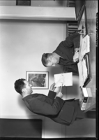 Bert Harwell, right, and Ed Beatty go over Muir material