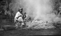 Maggie Howard cooking back of Museum.