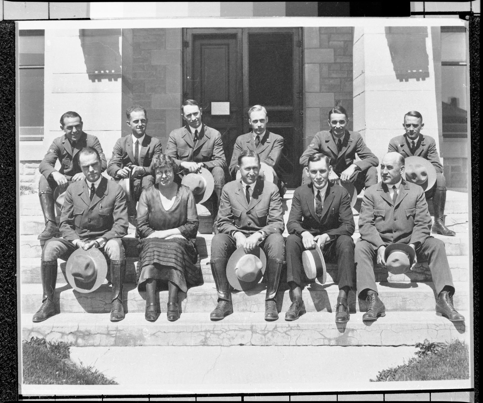 Copy Neg:J. Ernest, 1983. (L-R) Top Row: Joe Joffe, _______, Levitt, ______, ______, ______. Bottom Row: Mr. Lewis, Julia Woodring, Mr. Albright, ______, ______ at the Supt. Office in Yellowstone National Park. Original print in the over-sized photo drawer in RL.