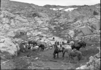 Saddle party north of Red Peak Pass in rugged granite country. On the trip: Supt. Frank Kittrredge, Mrs. Kittredge, Catherine Jane Kittredge, Majorie Williams, John Wegner, Harry During, Mary During, Ralph H. Anderson, Louie Austin (packer), and Chief Ranger Townsley (part of the trip).