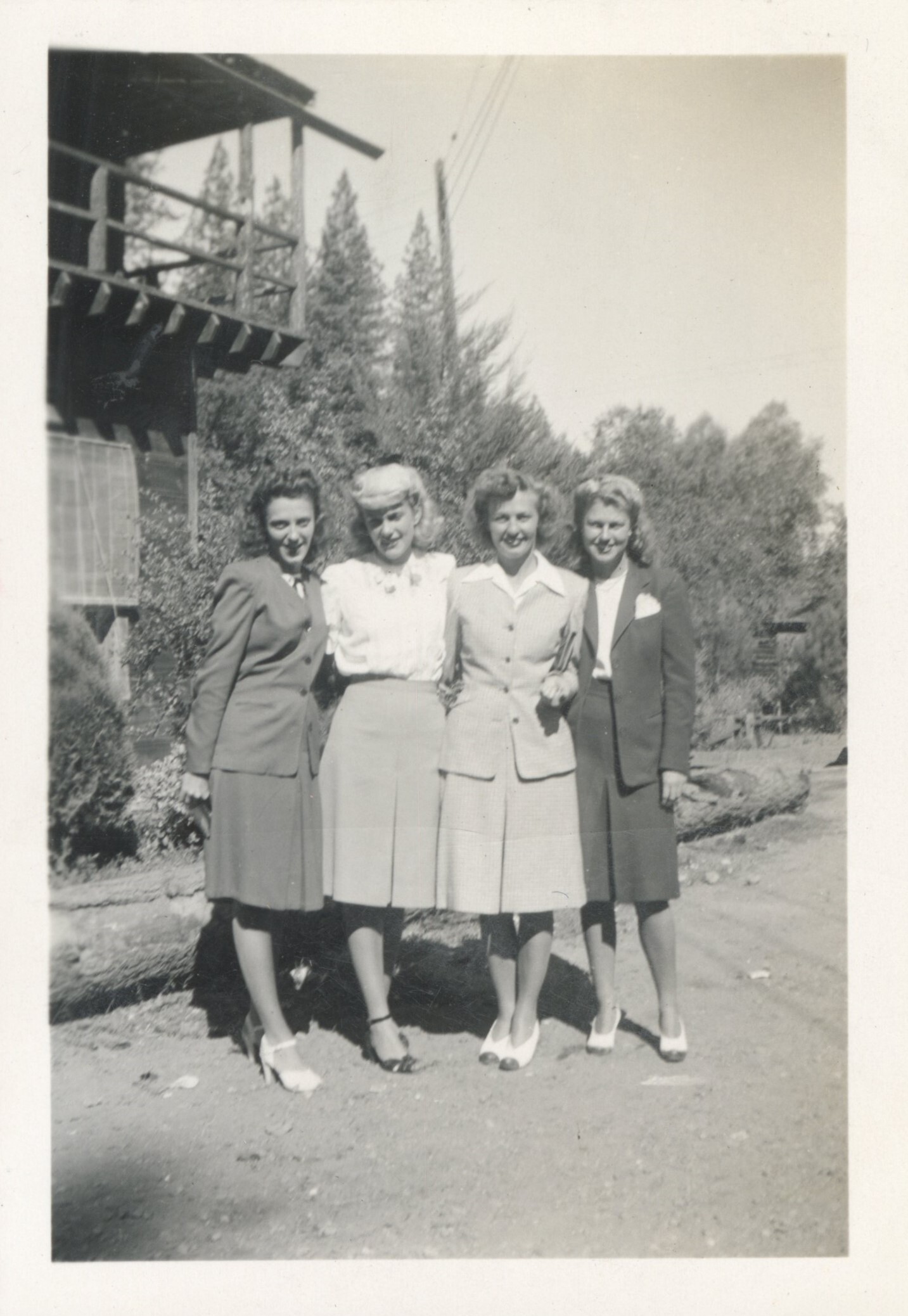 Four nurses in suit dresses