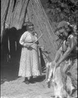 Tabuce (Maggie Howard) singing and keeping time for Le-me (Chris Brown) in Museum garden.