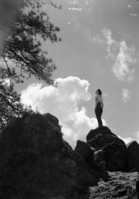Girl on cloudy skyline