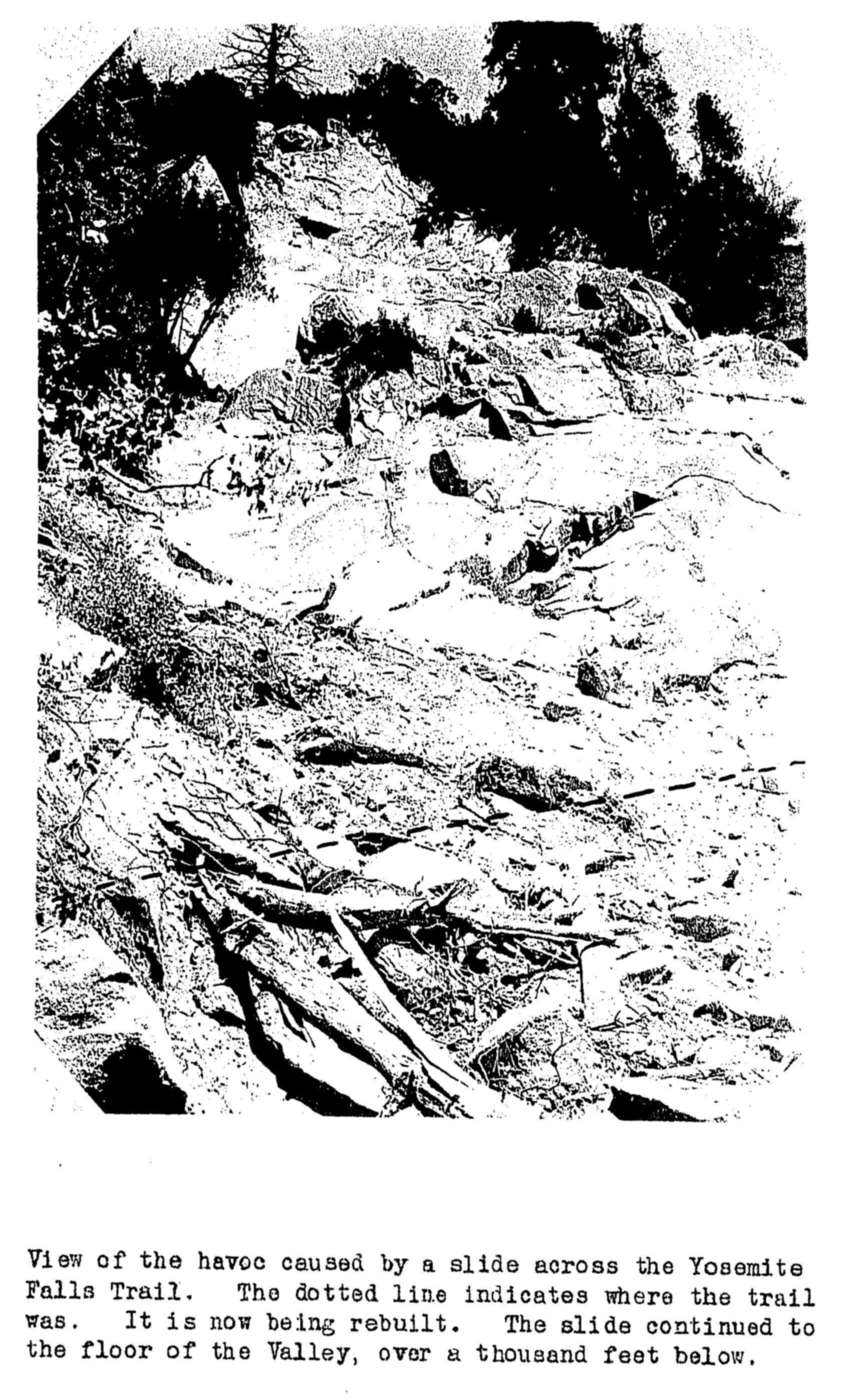 Path of a rock slide with broken trees and boulders covering the trail below.