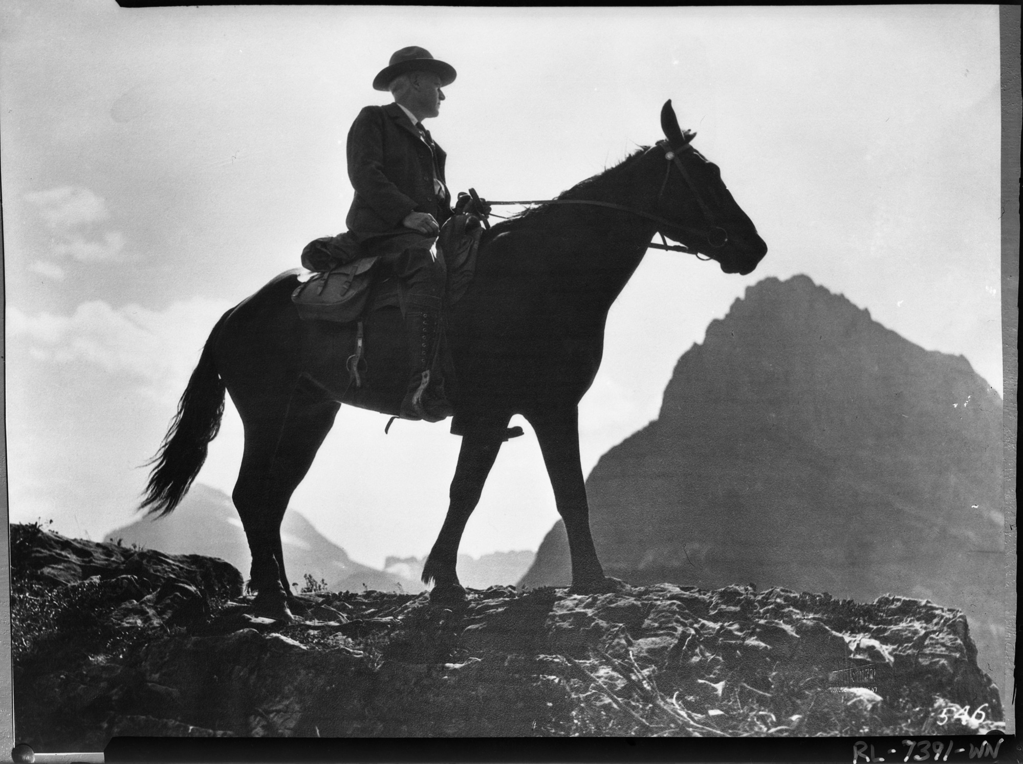 Stephen Mather, founder of NPS. (Original photo in the NPS office in Hilgard Hall). Inspecting the trails of Glacier National Park.