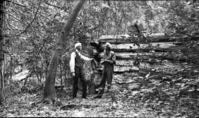 Muir's "Lost cabin" on Tenaya cr. [On negative envelope]: Mr. Dan Foley & George Wharten James standing beside what Mrs. Foley called the "Lost Muir Cabin". Copy Neg: 1992, Mike Floyd